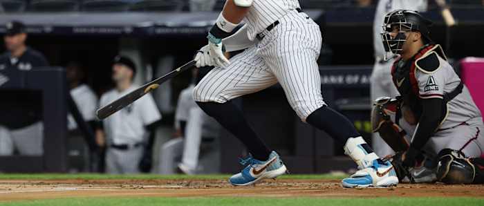 Detailed view of Aaron Judge's blue, white, and red Air Jordan cleats.